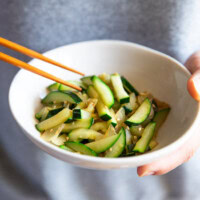 Holding a bowl of Korean zucchini stir fry.
