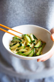 Holding a bowl of Korean zucchini stir fry.
