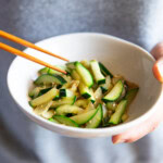 Holding a bowl of Korean zucchini stir fry.