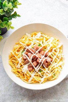 Spam egg mayo rice bowl served in a shallow bowl, with the rice hidden underneath as the base.